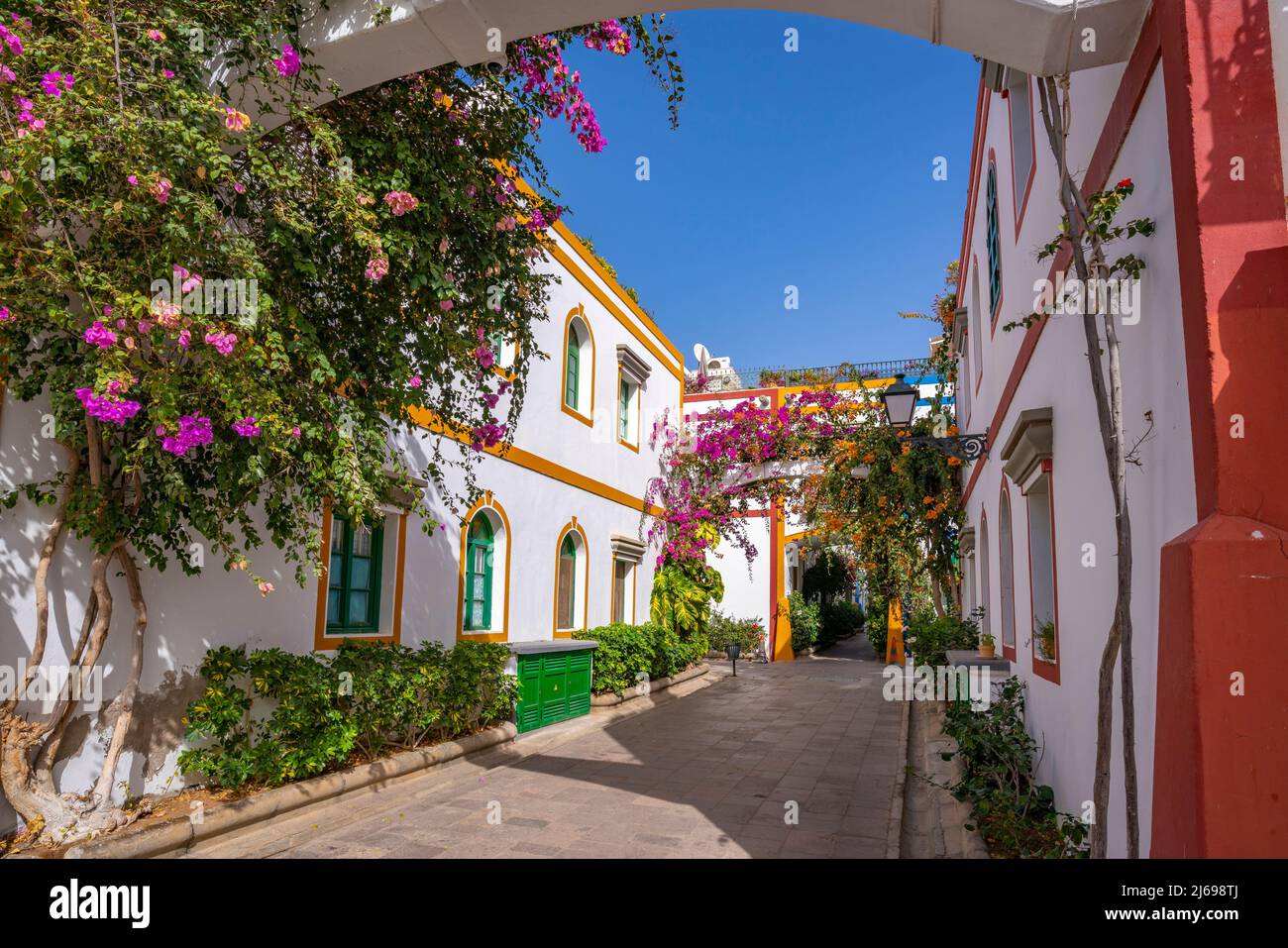 View of colourful buildings and flowers in the old town, Puerto de Mogan, Gran Canaria, Canary Islands, Spain, Atlantic, Europe Stock Photo