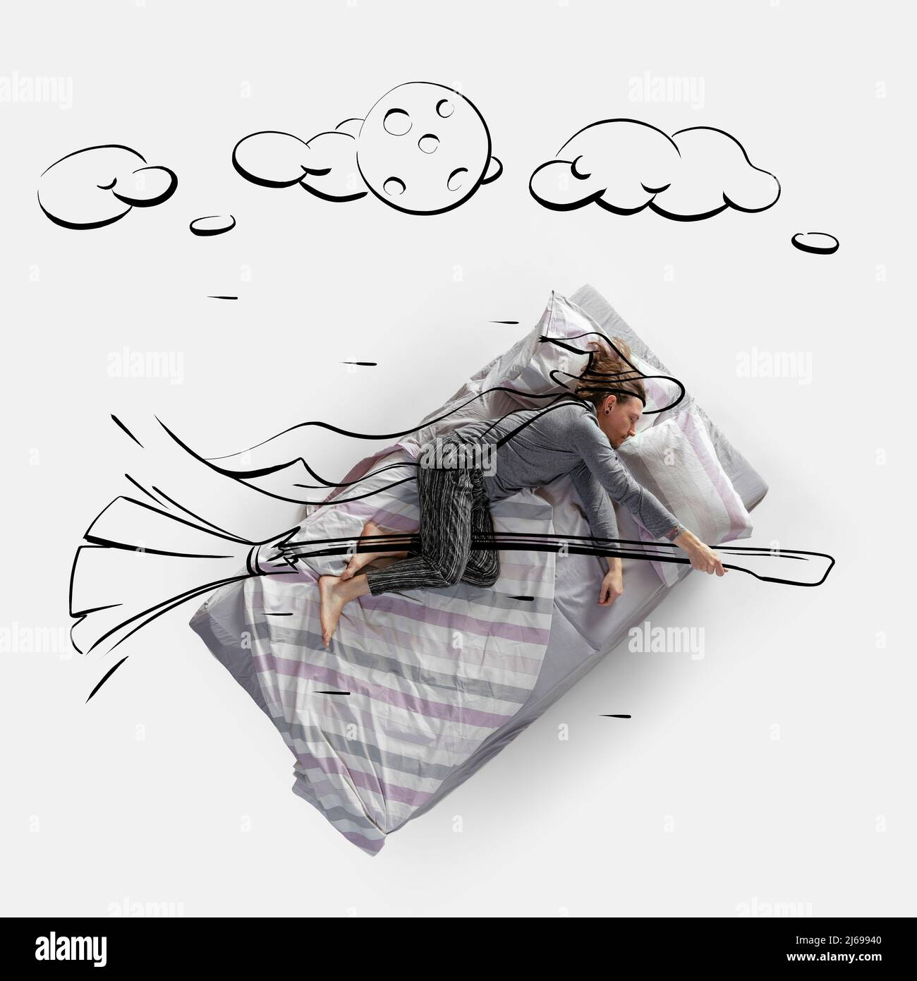 Creative image. Top view of young man lying on bed, sleeping, dreaming