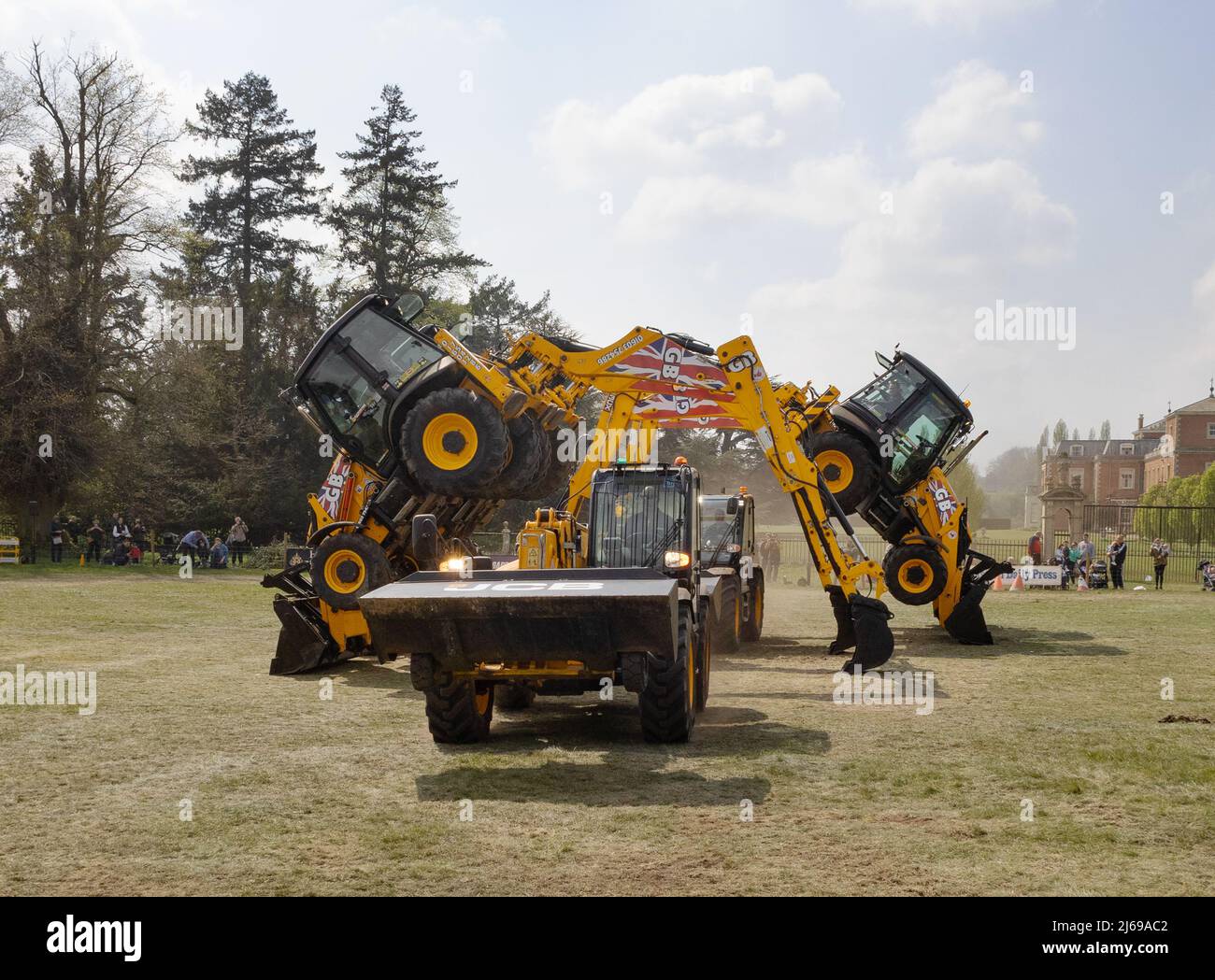 JCB Dancing Diggers display team - heavy machinery showing what it can do; East Anglian Game & Country Fair UK Stock Photo