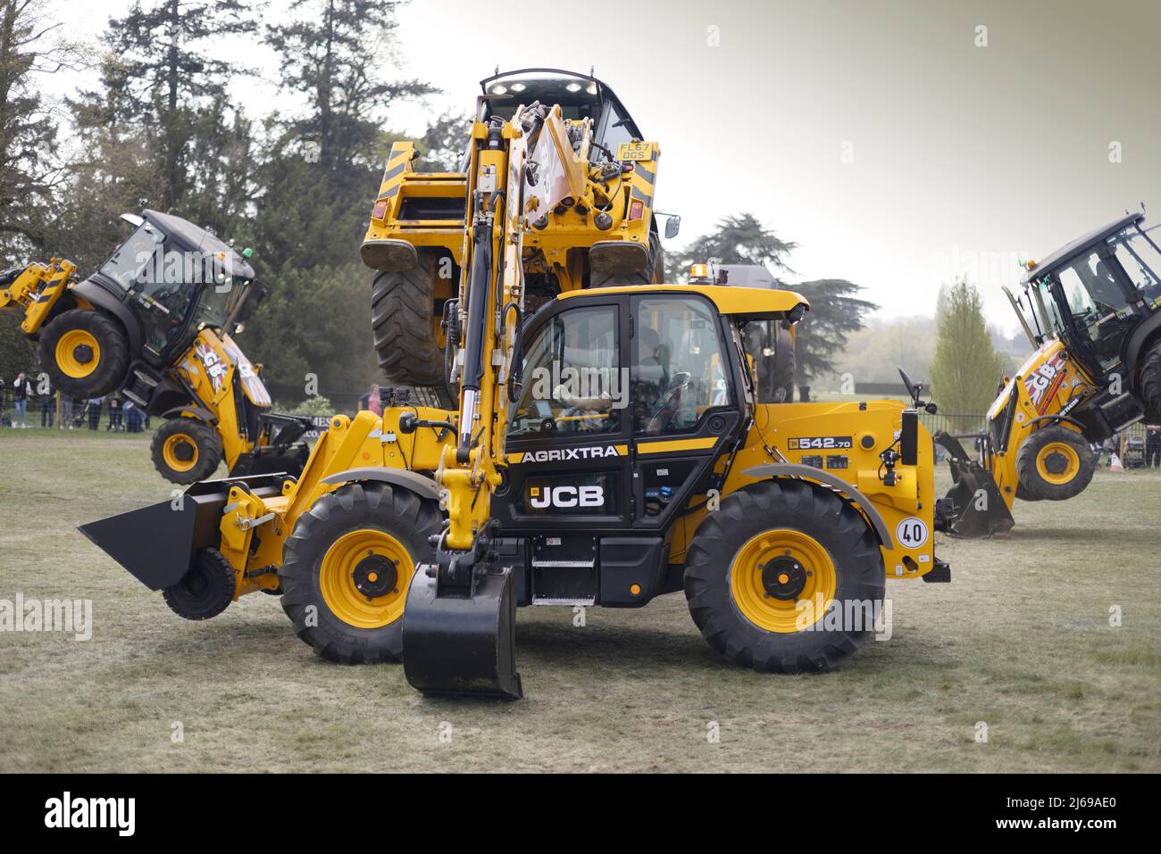 JCB Dancing Diggers display team - heavy machinery showing what it can do; East Anglian Game & Country Fair UK Stock Photo