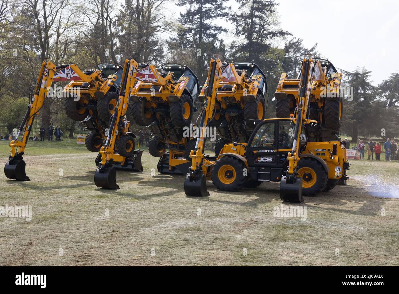 JCB Dancing Diggers display team - heavy machinery showing what it can do; East Anglian Game & Country Fair UK Stock Photo