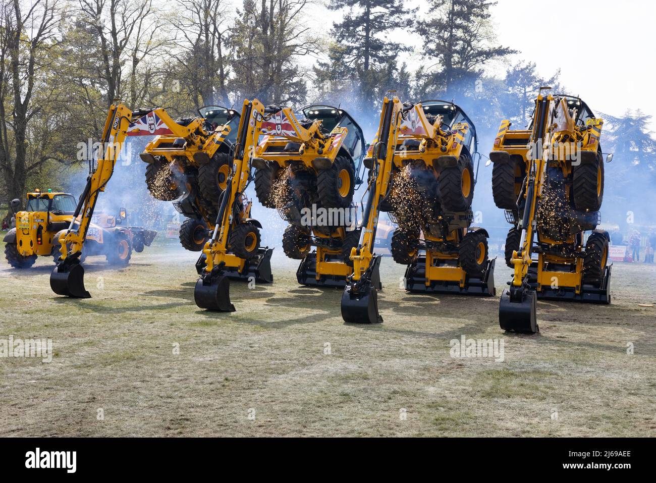 JCB Dancing Diggers display team - heavy machinery showing what it can do; East Anglian Game & Country Fair UK Stock Photo