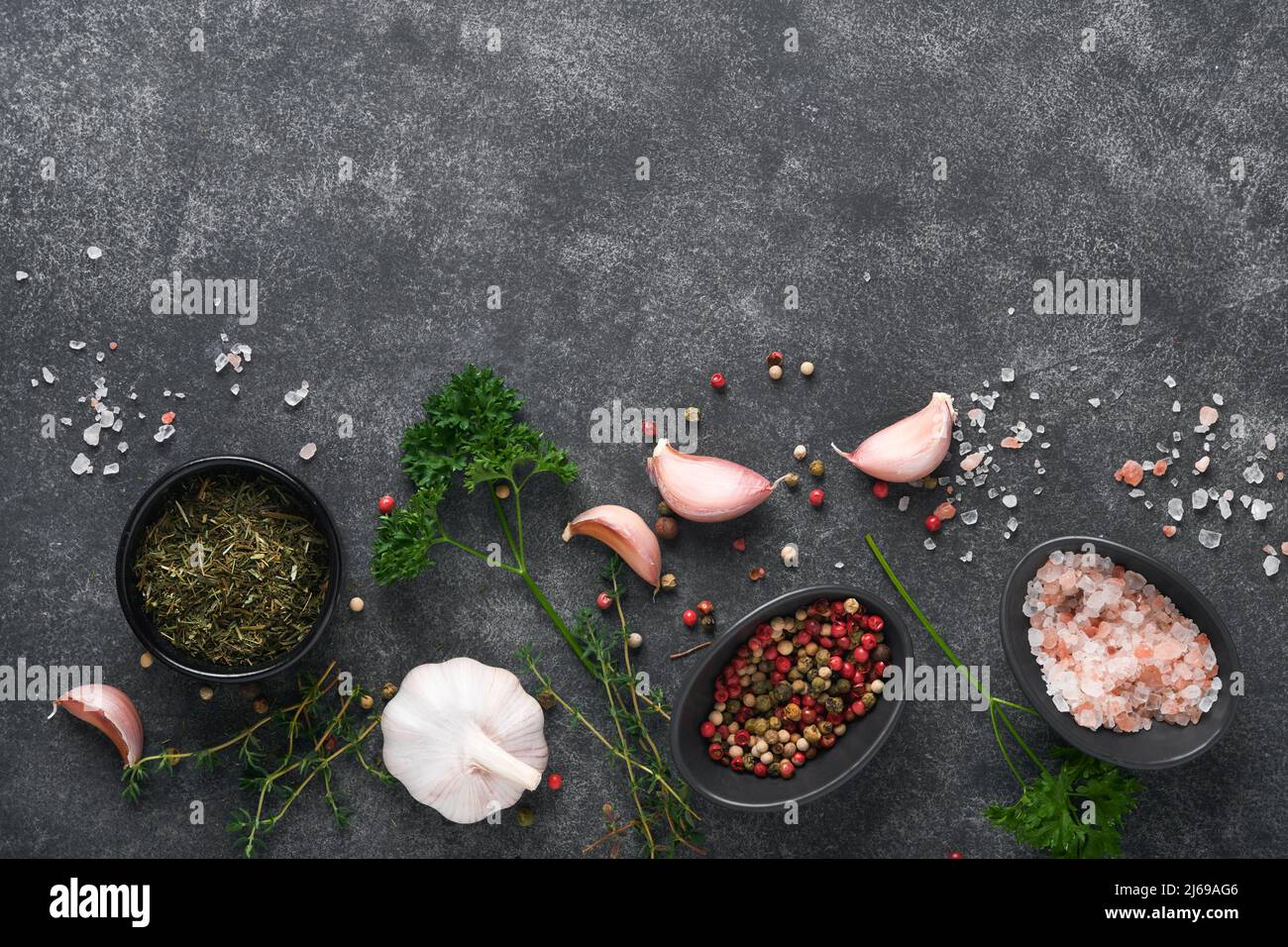 Black food cooking background. Stone texture with sea salt, pepper