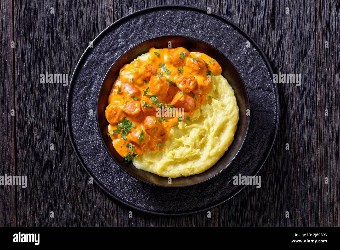nakkikastike, sausage bites in creamy tomato sauce with potato mash in