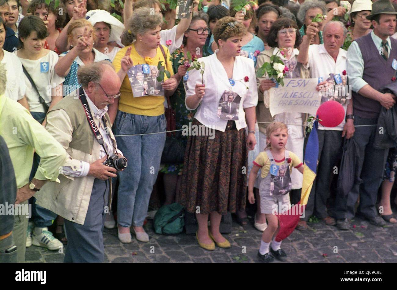 Bucharest, Romania, 1990. Supporters of the presidential candidate (later president) Ion Iliescu in the first 'free elections' after the fall of communism. In the front, journalist Ioan Grigorescu. Stock Photo