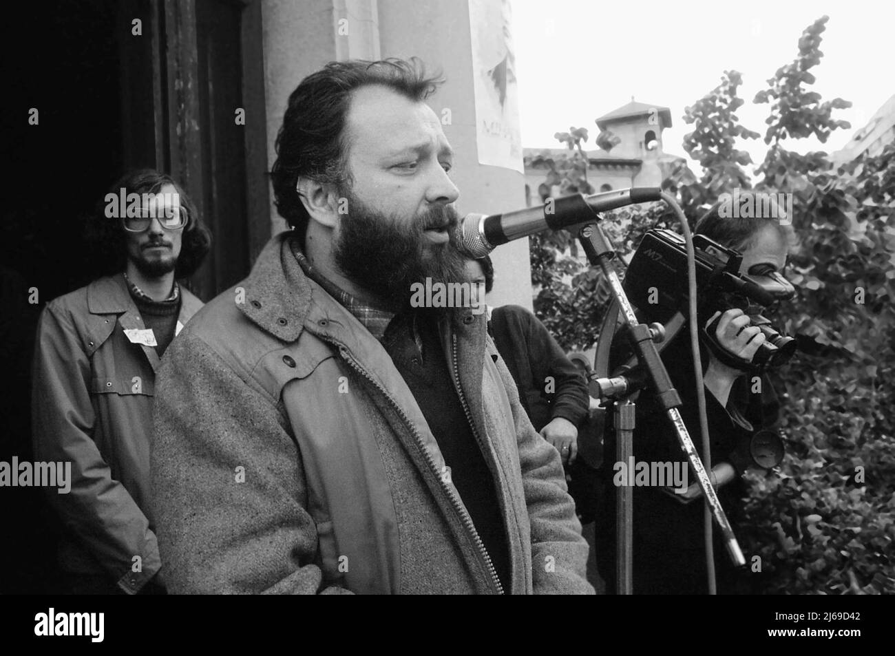 Bucharest, Romania, April 1990. Writer & political figure Stelian Tanase speaking from the famous balcony of the University building, during 'Golaniada', a major anti-communism protest in Piata Universitatii, following the Romanian Revolution of 1989. Behind him, then journalist Cătălin Harnagea, later director of the Foreign Intelligence Service. Stock Photo