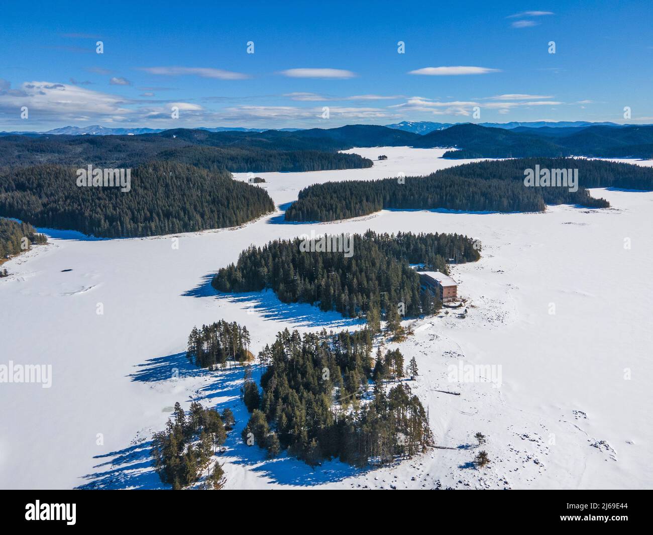 aerial-winter-view-of-shiroka-polyana-wide-meadow-reservoir-covered