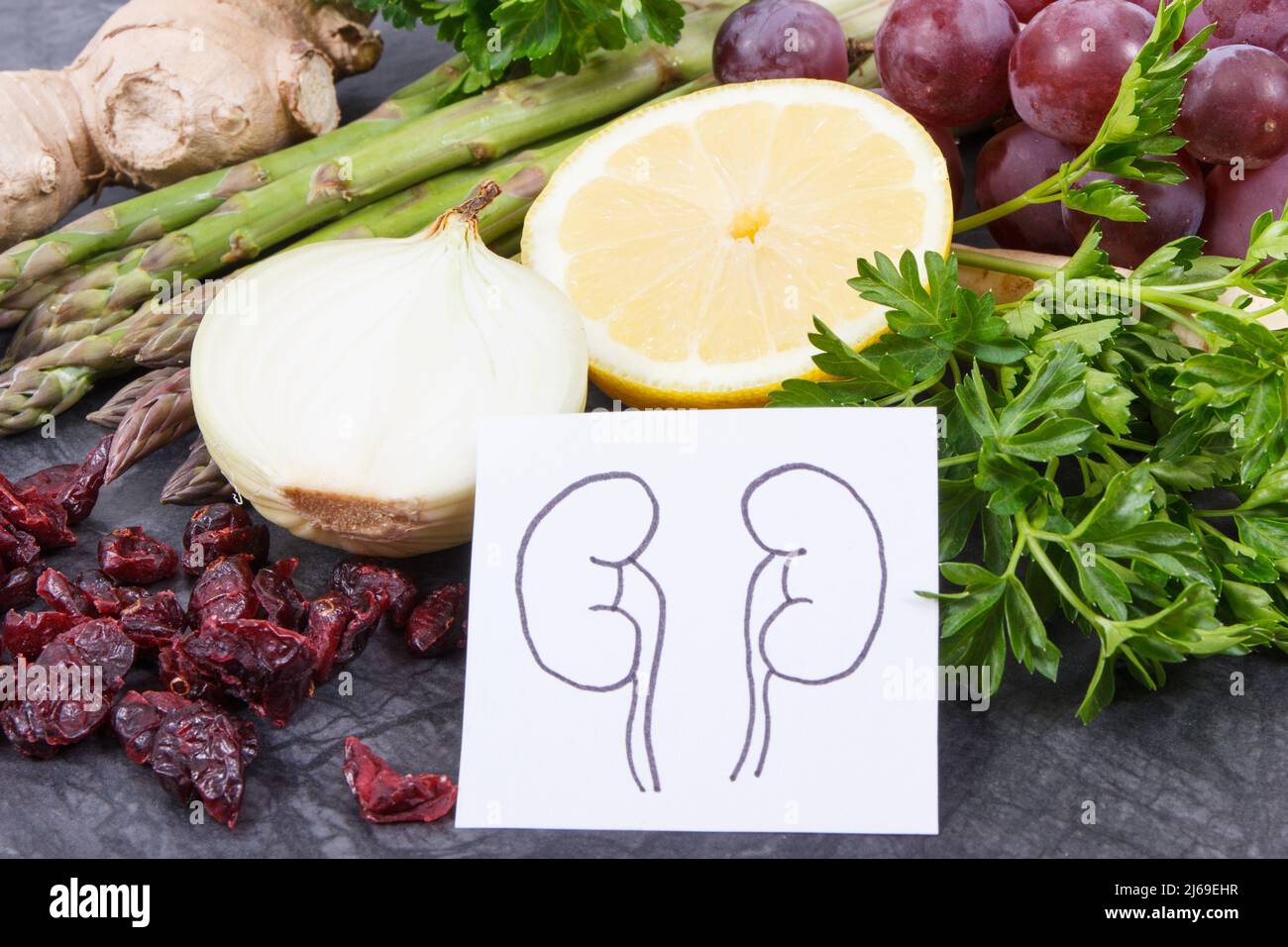 Drawing of kidneys and fresh healthy eating containing natural vitamins