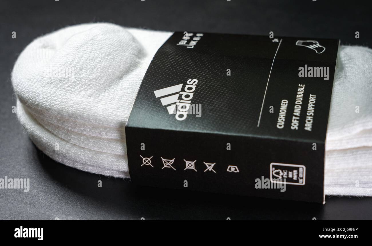 A pack of Adidas cotton socks on a black background. Stock Photo