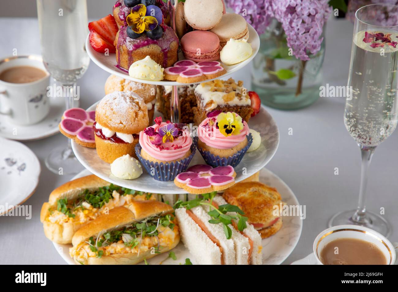 Traditional english afternoon tea with selection of cakes and sandwiches Stock Photo