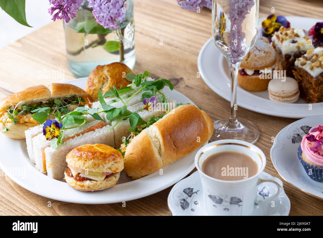 Traditional english afternoon tea with selection of cakes and sandwiches Stock Photo