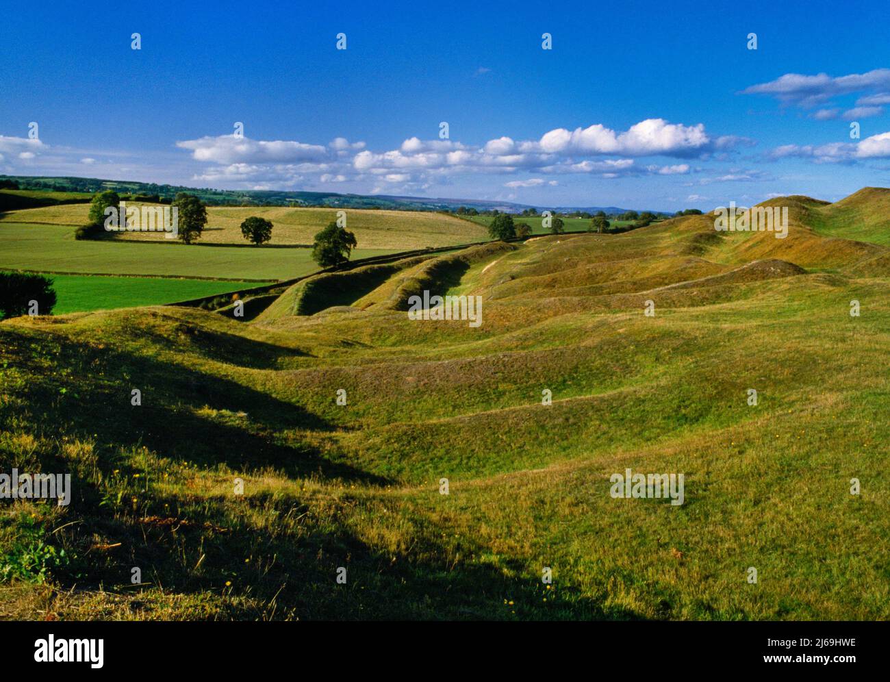 View N of Old Oswestry Iron Age hillfort, Shropshire, England, UK showing the sunken entrance passage at the SW cutting through the five ramparts. Stock Photo