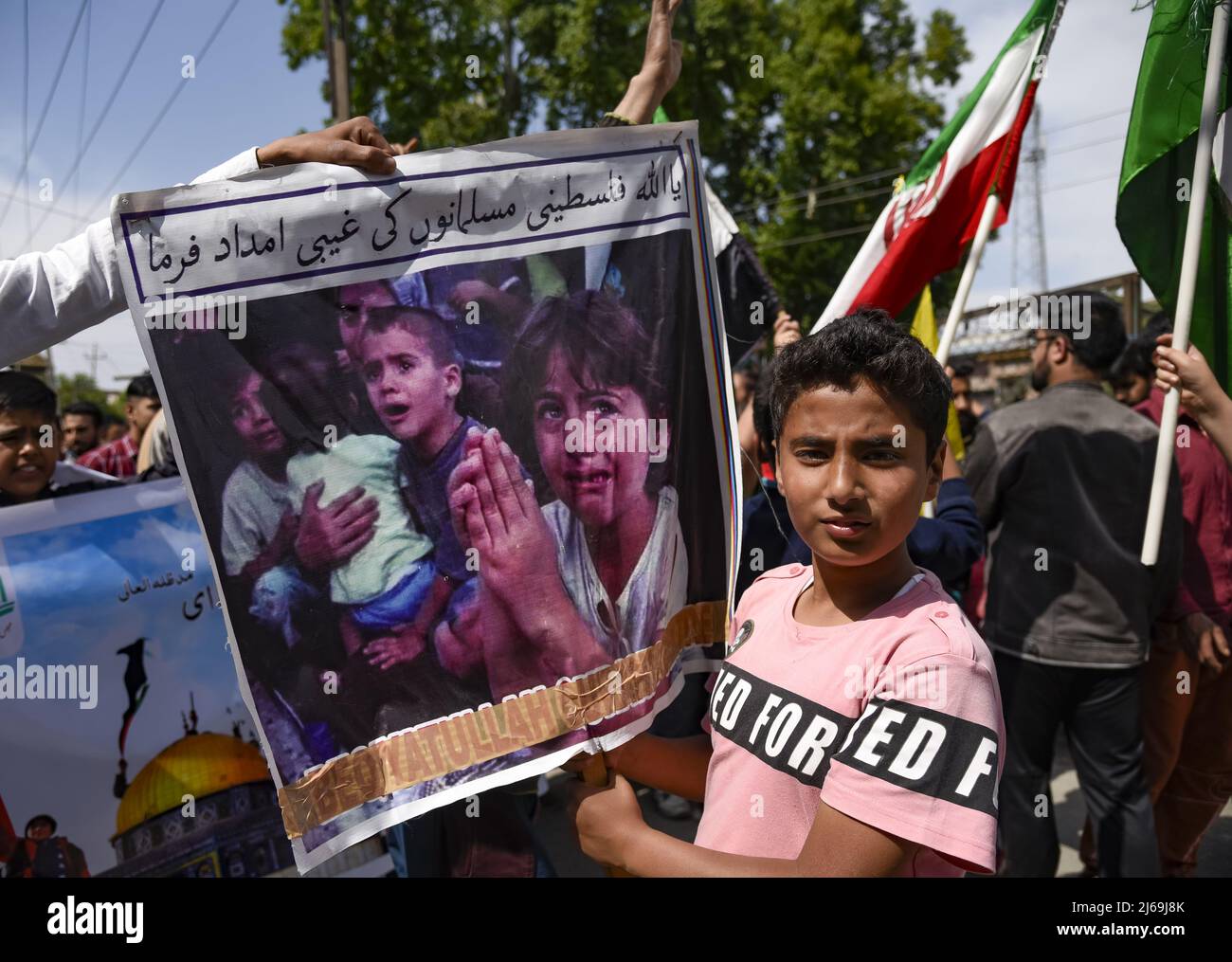 Kashmir, India. 29th Apr, 2022. A Kashmiri Muslim boy holds a placard ...