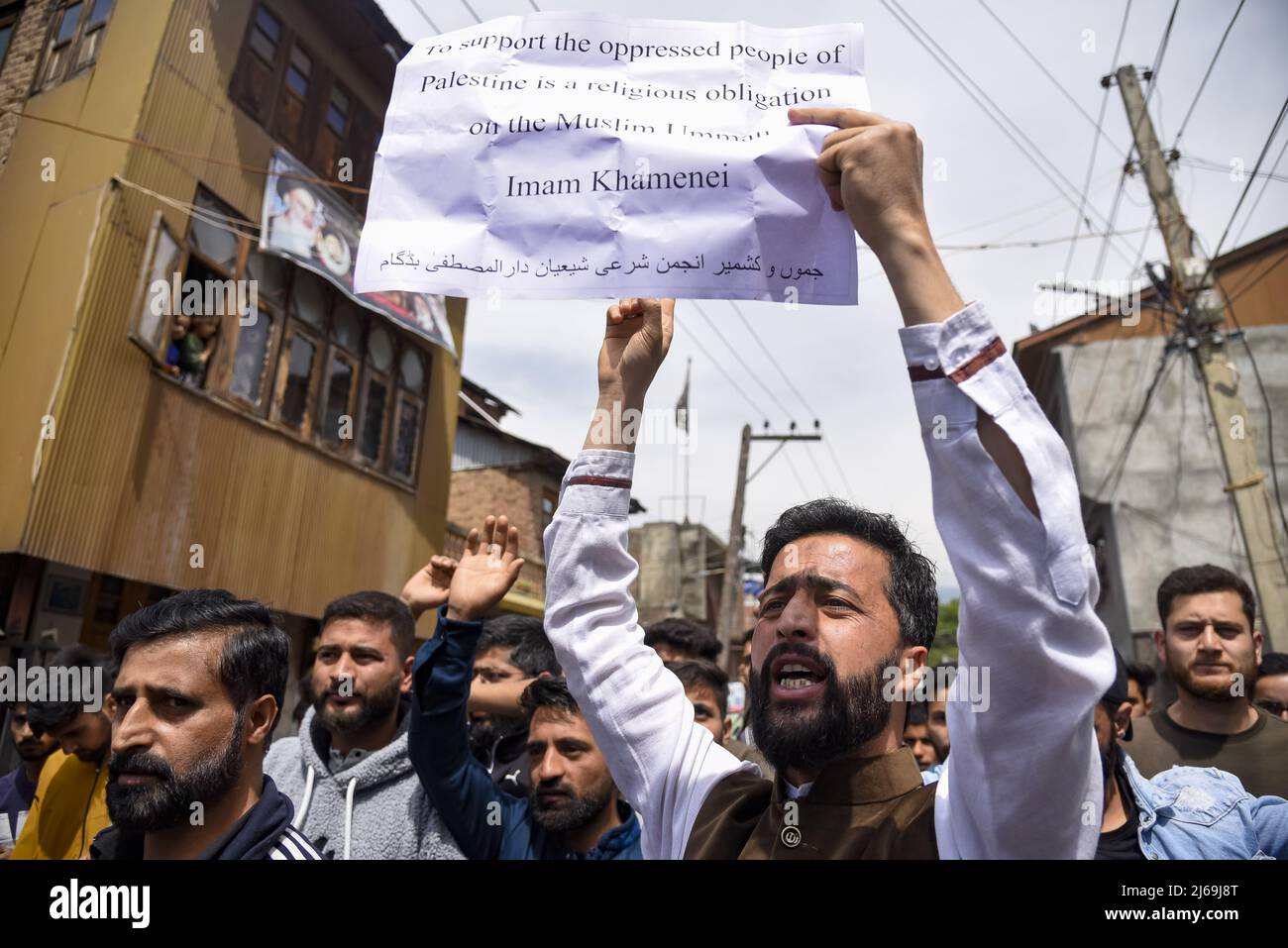 Kashmir, India. 29th Apr, 2022. A Kashmiri Muslim man holds a placard ...