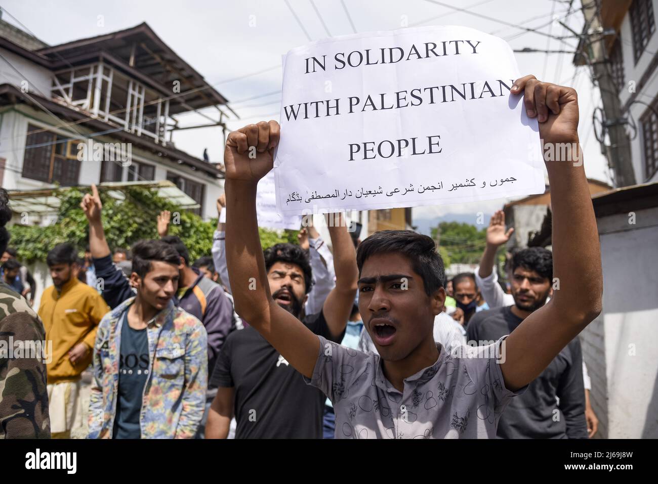 Kashmir, India. 29th Apr, 2022. A Kashmiri Muslim boy holds a placard ...
