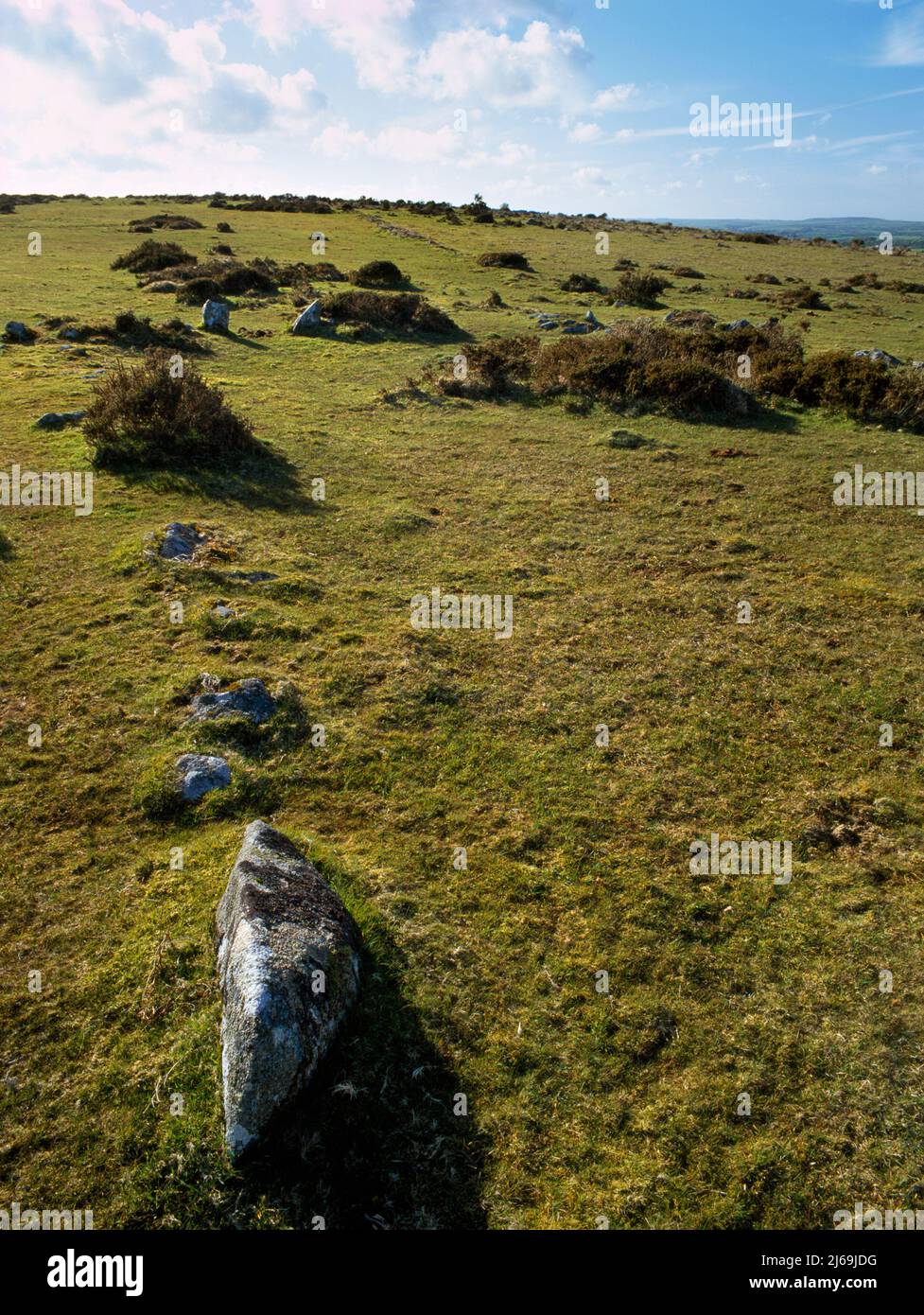 View WNW of the two stone gateposts & low collapsed drystone walls of a Bronze Age field on East Moor, Bodmin Moor, Cornwall, England, UK. Stock Photo