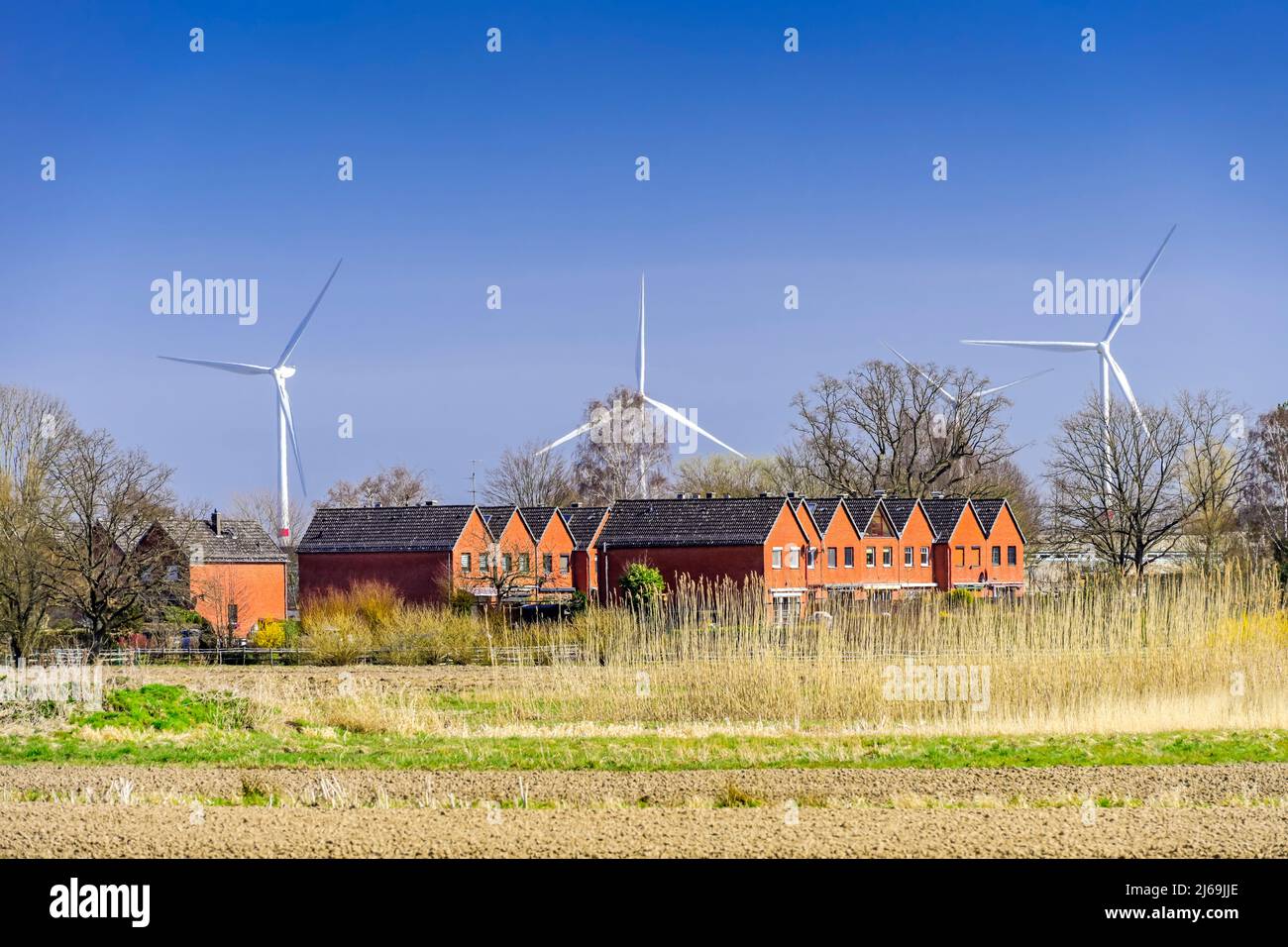 Residential Area And Wind Turbines In Kirchwerder, Hamburg, Germany Stock Photo