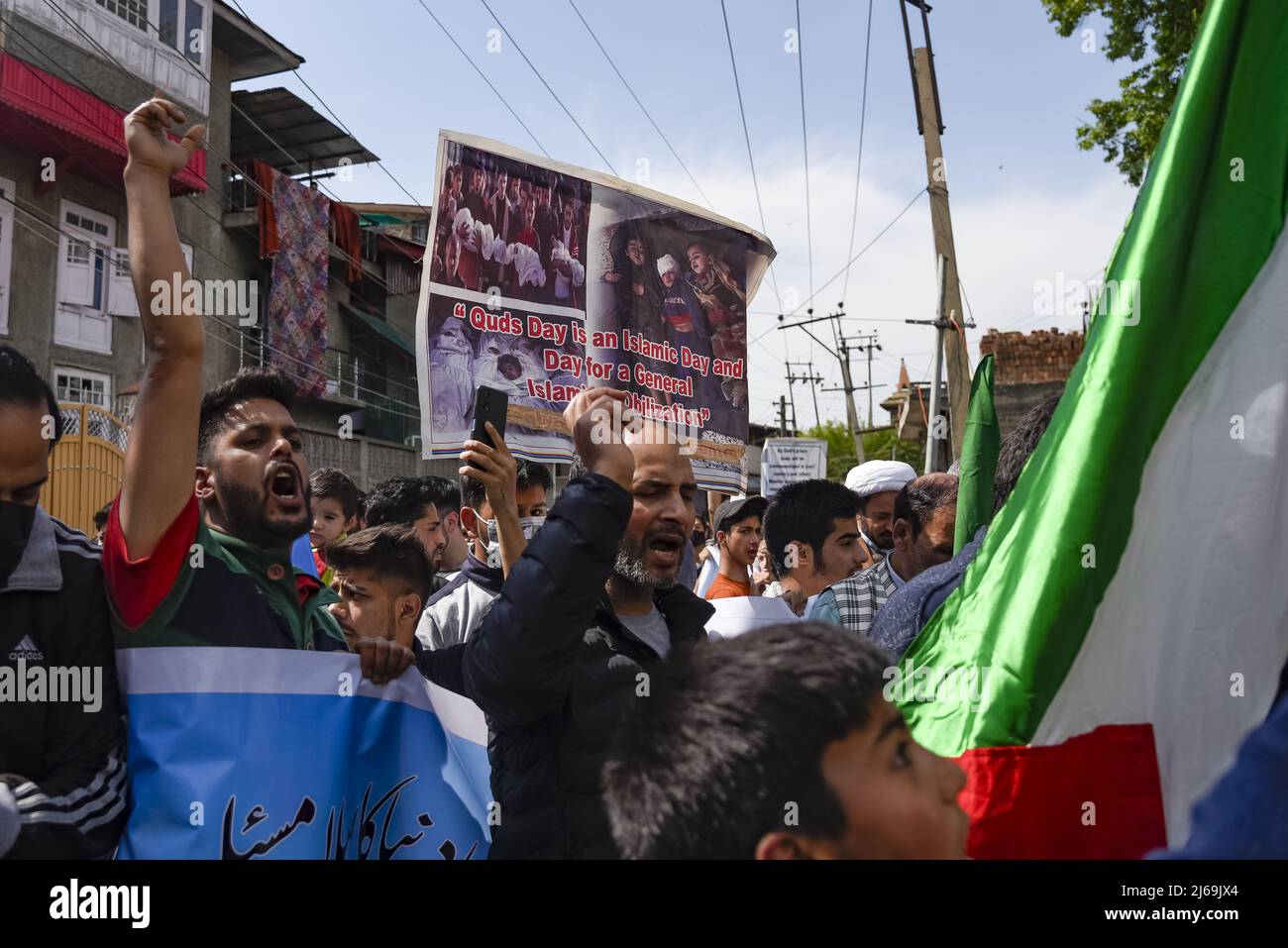 Kashmiri Muslims hold placards while shouting Pro Palestine and ...