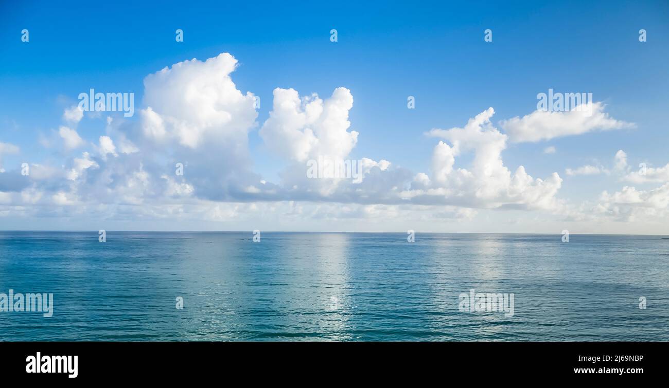 Early morning clouds over the  Atlantic Ocean off Isla Verde Beach in the Metropolitan Area of San Juan in Carolina Puerto Rico, Stock Photo