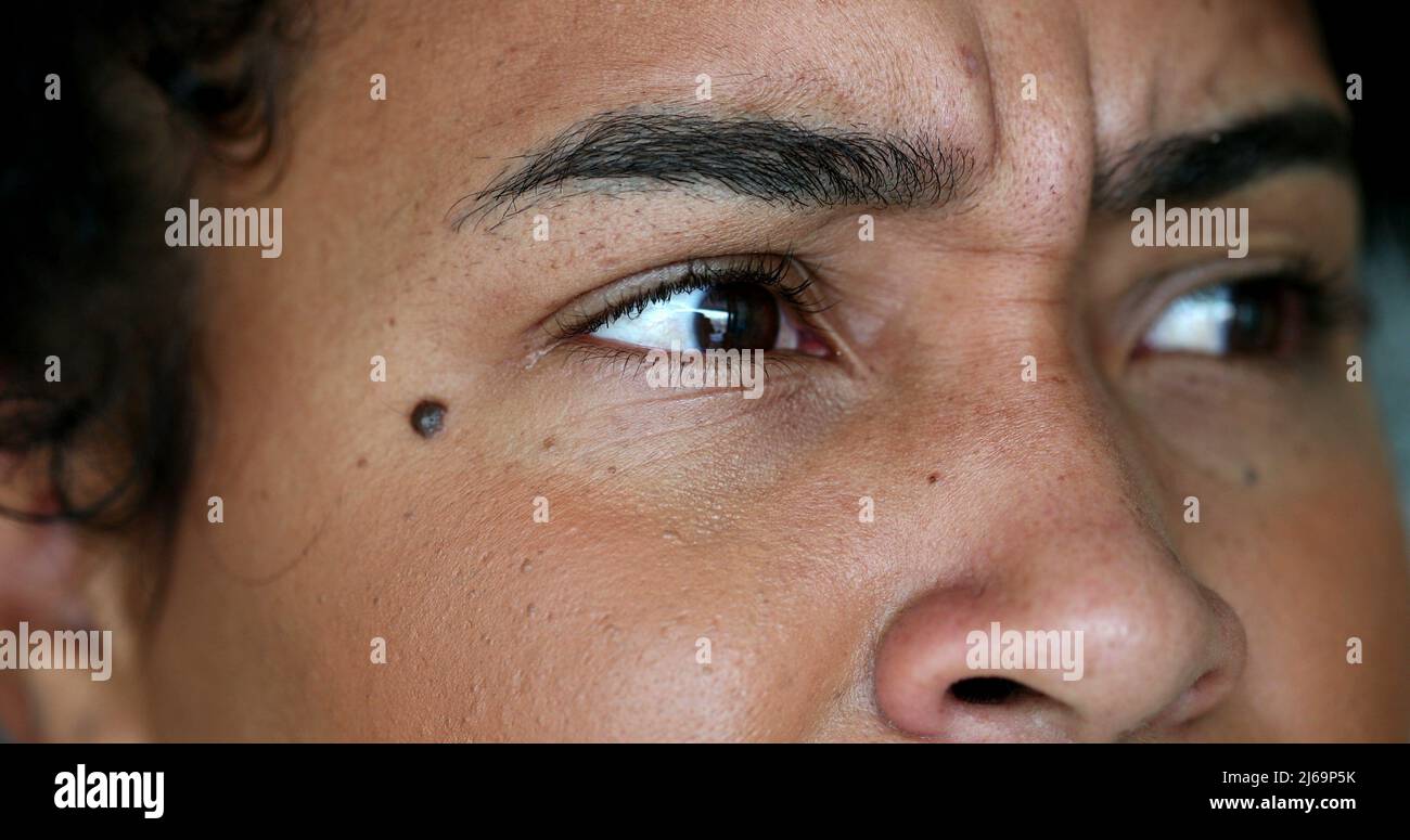 Stressed woman feeling PTSD emotional reaction, closeup face and eyes
