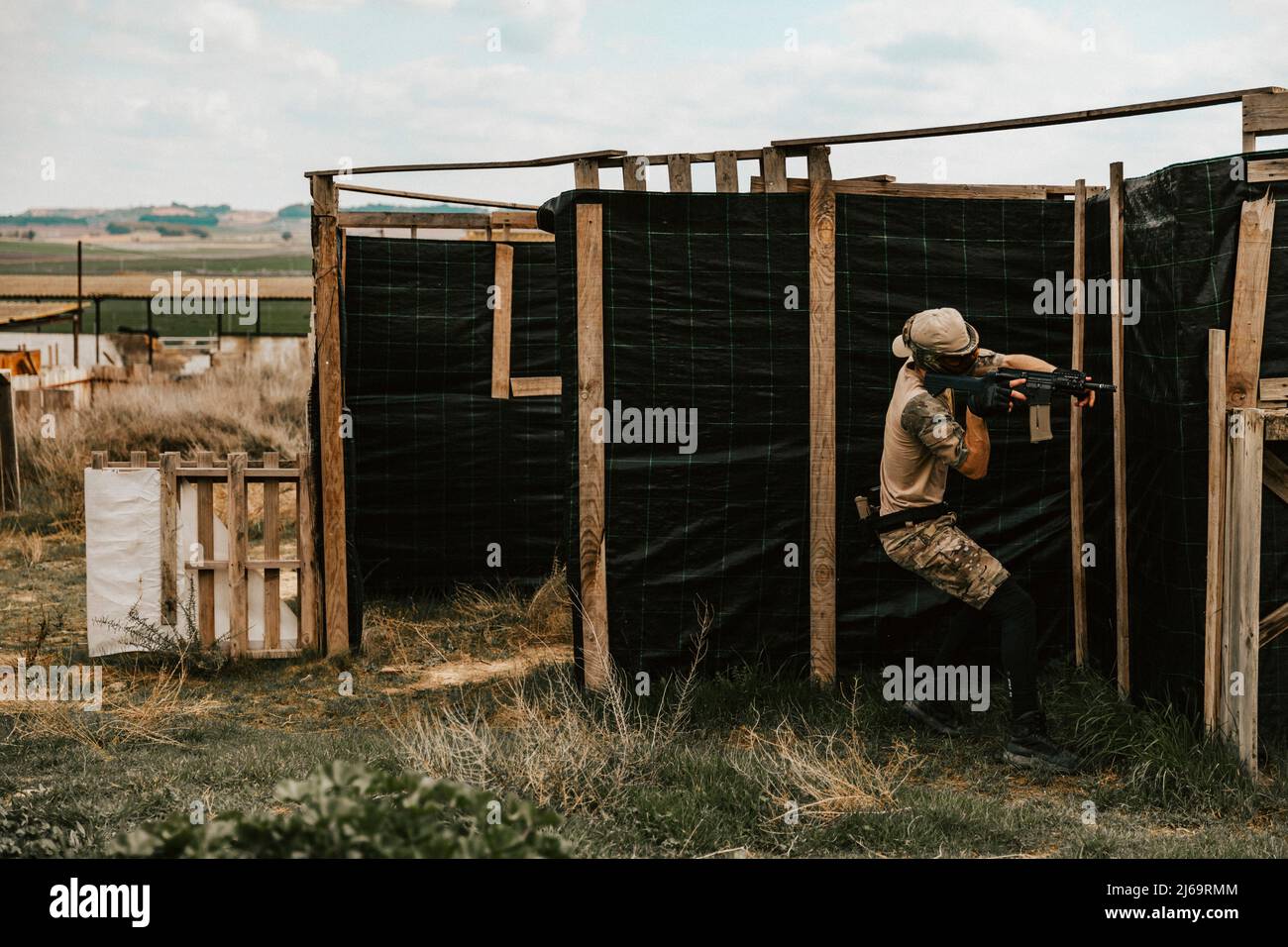 Soldiers carefully advancing position in the middle of an airsoft game Stock Photo