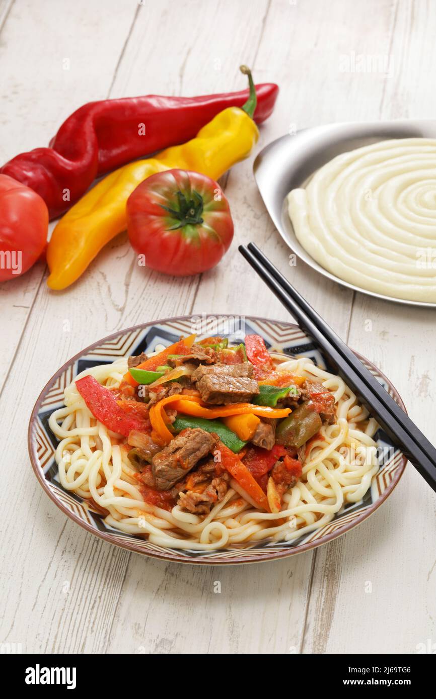 Laghman, hand pulled noodles dish with lamb meat and vegetables, Uyghur cuisine Stock Photo