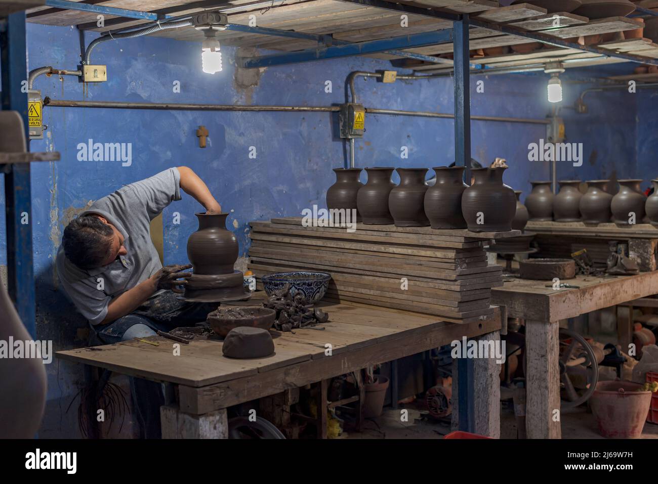 Workstation of a latin craftsman that produces talavera pottery Stock Photo