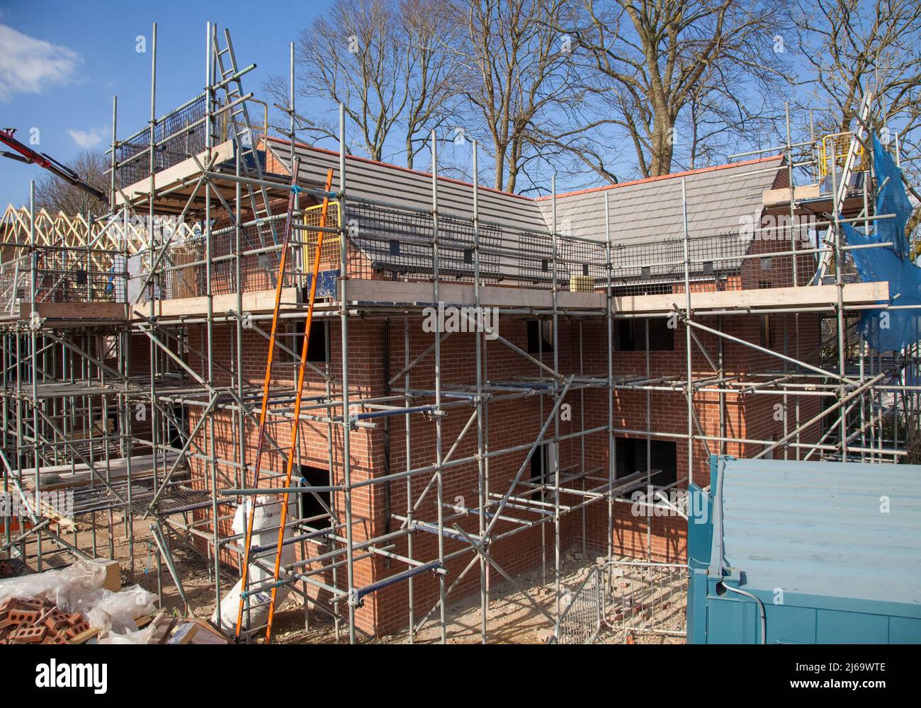 Work in progress, building site,building work,scaffolding,ladders,roofing,brickwork,bricks. Stock Photo