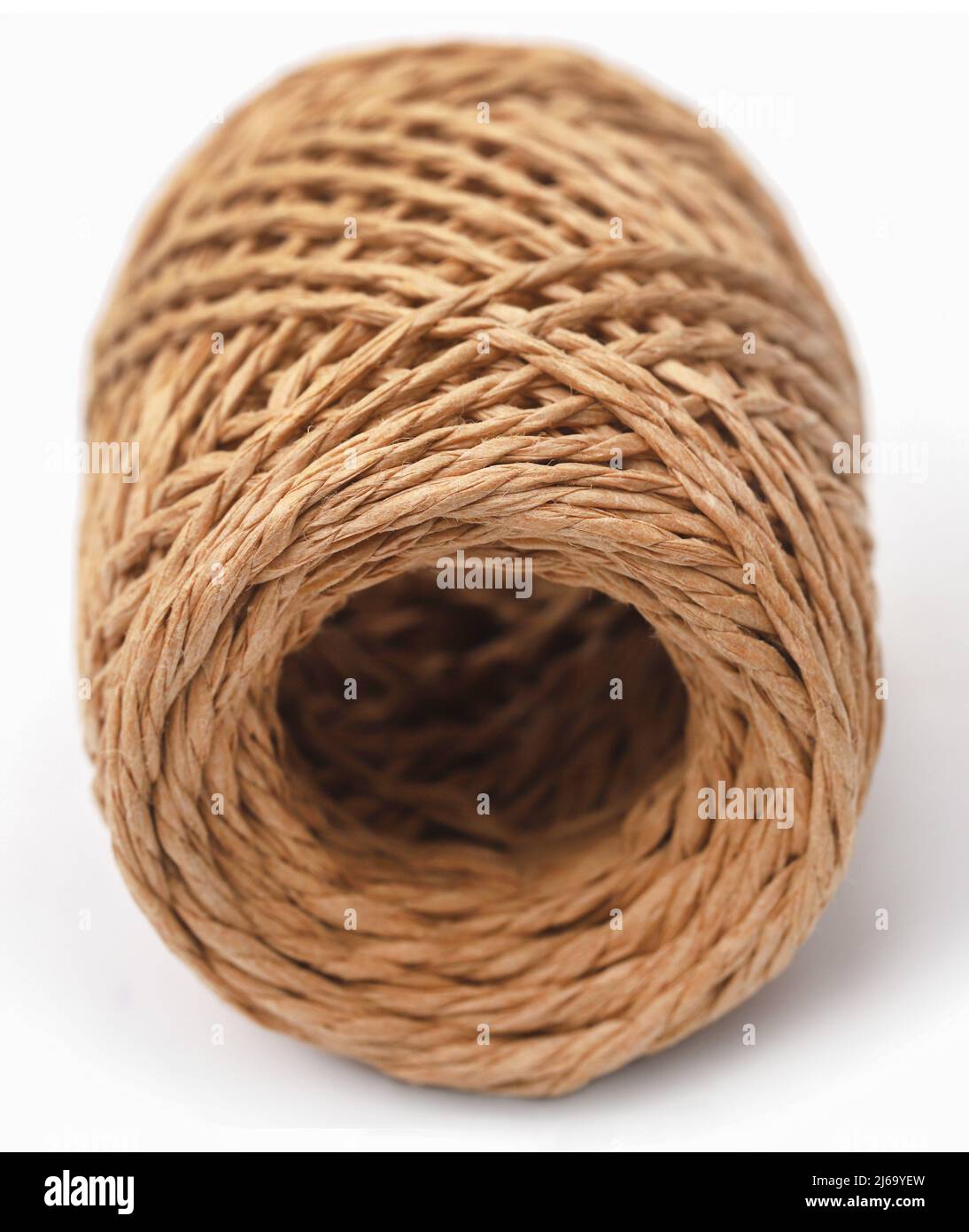 Thread ball made of natural jute fiber over white background Stock