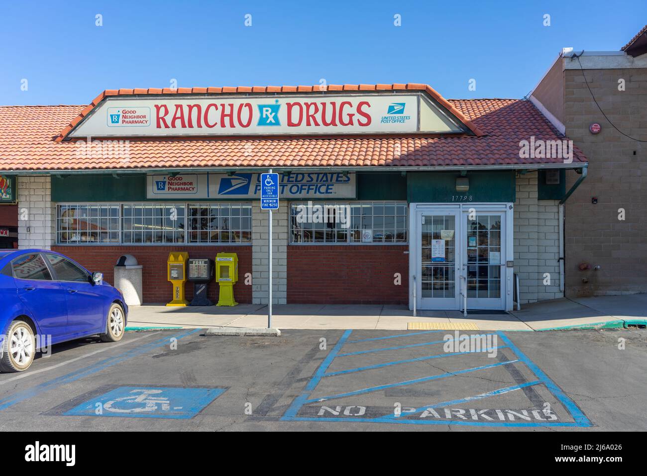 Apple Valley, CA, USA – April 20, 2022: Rancho Drugs, a local pharmacy with a US Post Office in the Town of Apple Valley, California. Stock Photo