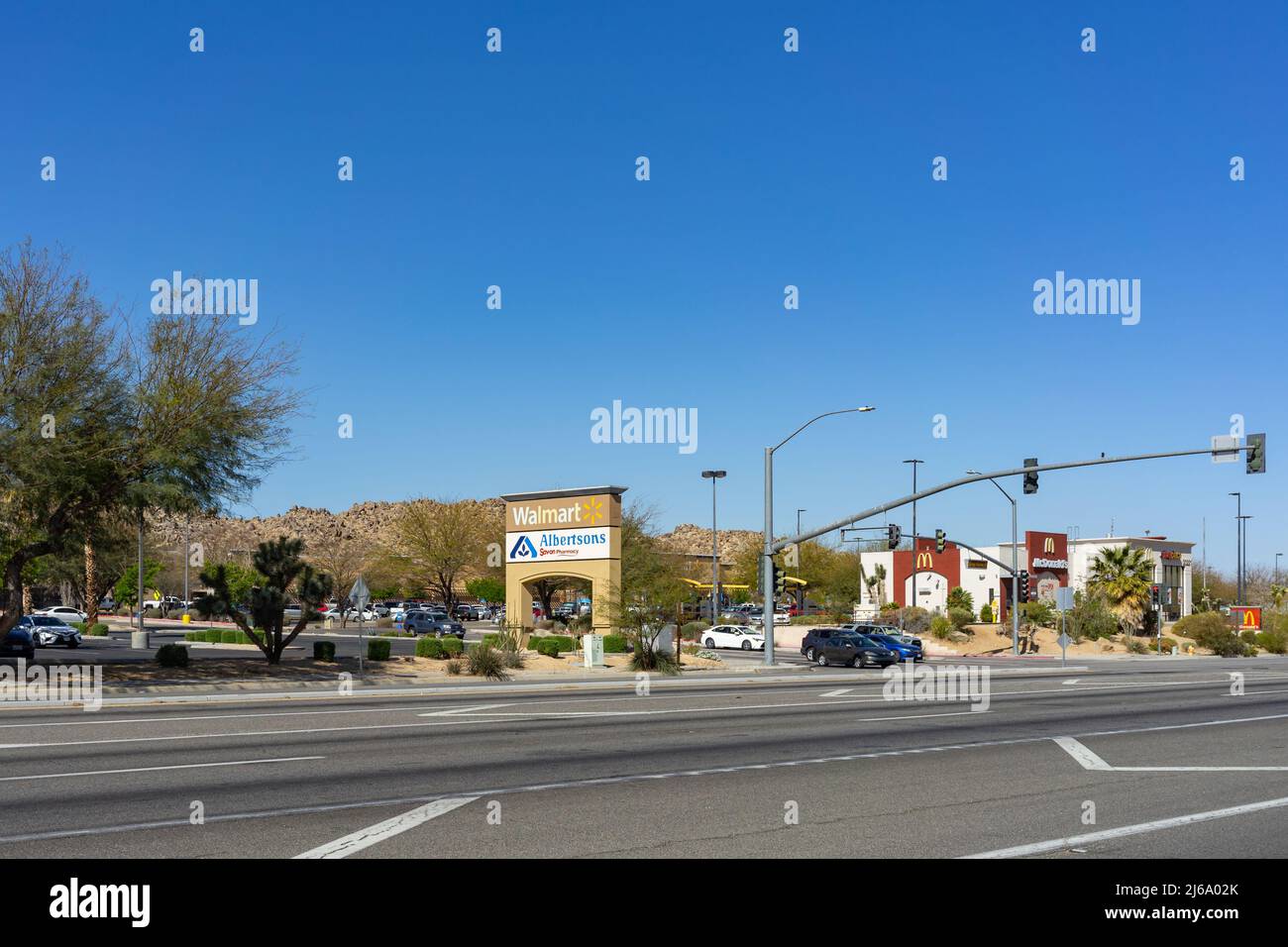 Apple Valley, CA, USA – April 20, 2022: Street view of a shopping center in the Town of Apple Valley, California, with a Walmart, Albertsons, and McDo Stock Photo