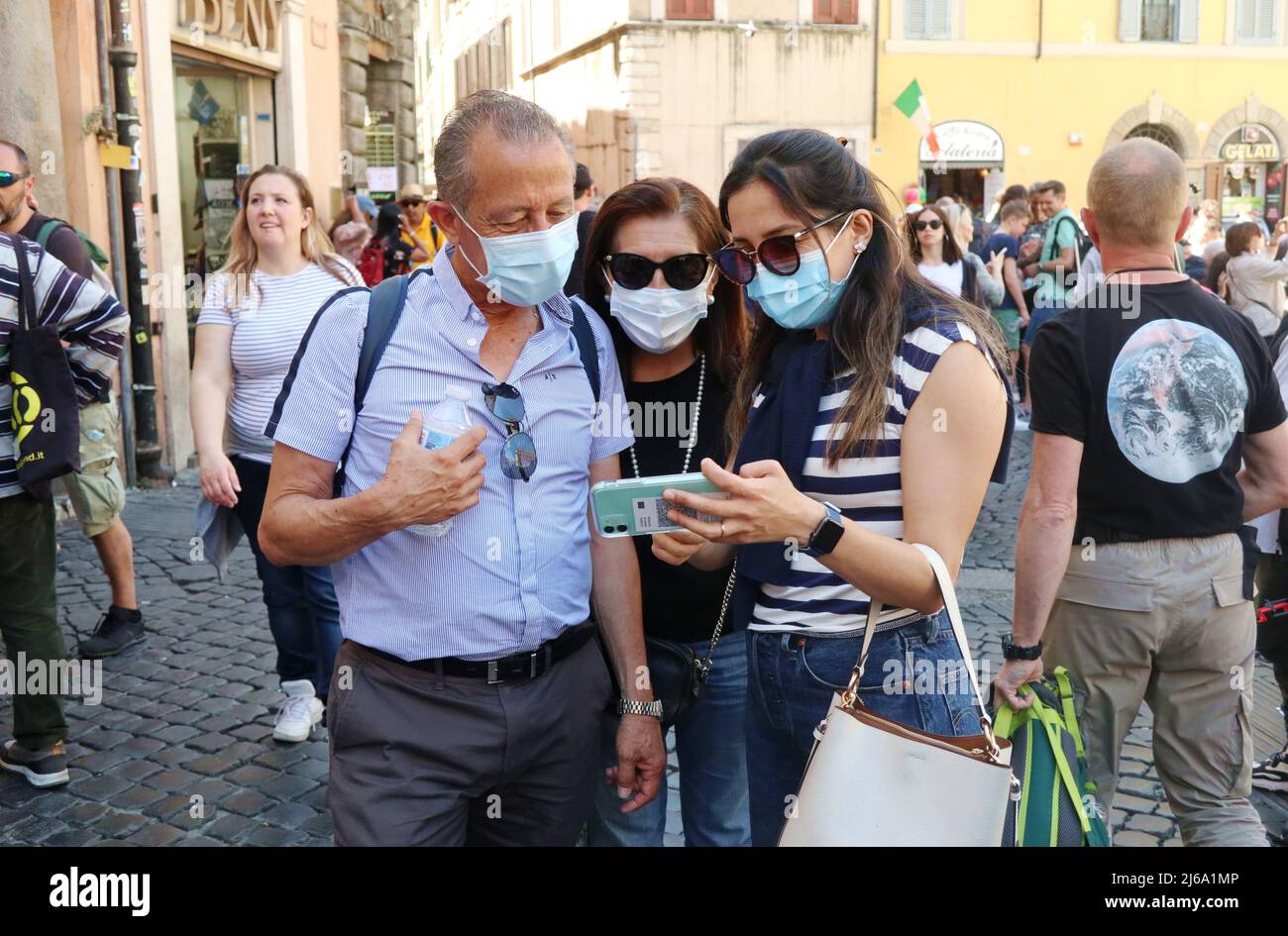 People wearing masks in Rome, Italy, April 29 2022. Italian Health minister Roberto Speranza announced that, in order to prevent a new spread of Covid 19 virus, Italy will extend mandatory indoor masks in some places until 15 June. This happened few days before Italy' rules of Covid 19 prevention expire on April 30. The requirement to wear masks will remain on public transports, in hospitals, rest houses, schools, universities, cinemas and theatres, at concerts and indoor sporting events. From May 1 on, instead, wearing masks will be optional in indoor restaurants and cafés, shops, supermarket Stock Photo