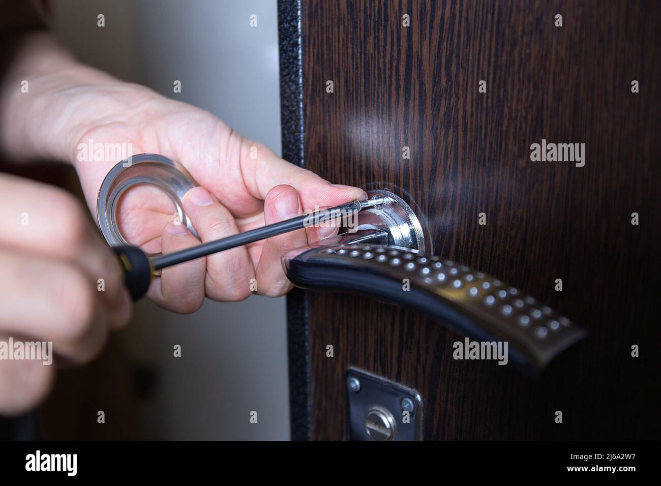 Locksmith replacing door lock to new after losing keys. Robbery
