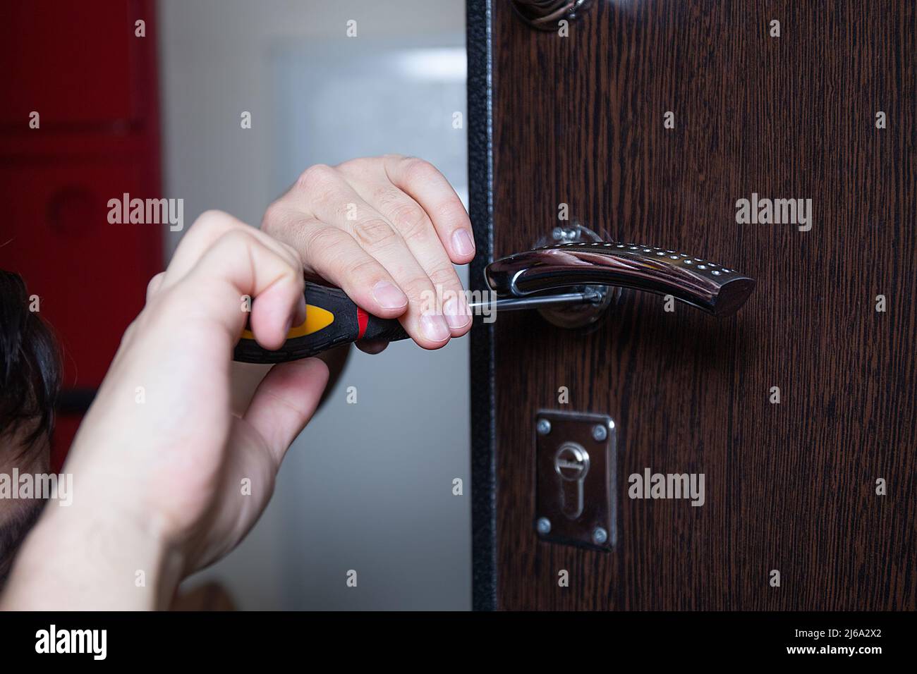 Locksmith replacing door lock to new after losing keys. Robbery