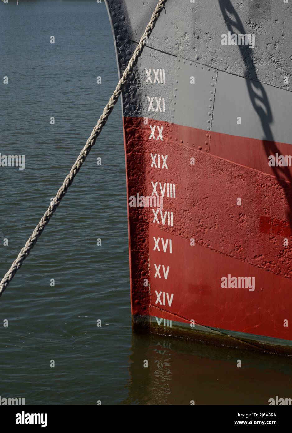 Draft marks on the bow of a ship in San Francisco, California. The marks reveal the distance from the waterline to to the bottom of the ship's hull. Stock Photo