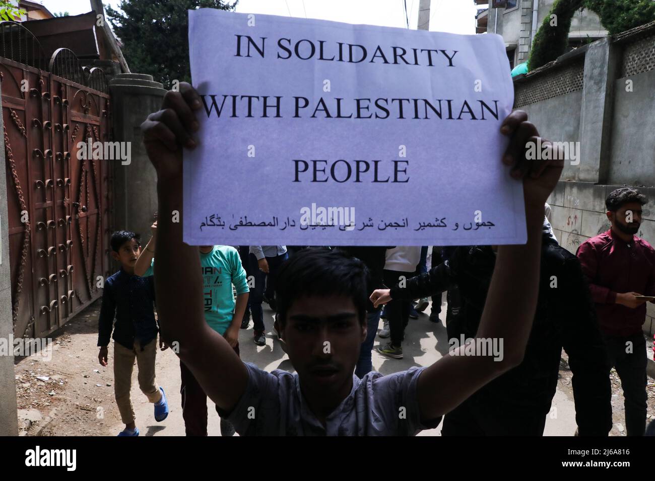 (4/29/2022) A Kashmiri Muslim holds a pro-palestainian poster during a ...