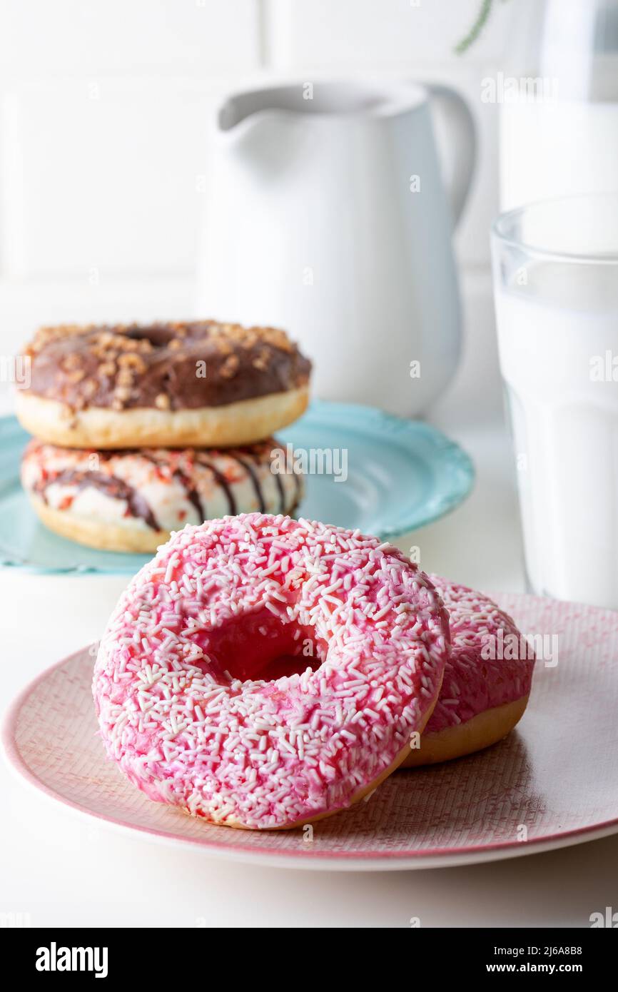 Strawberry and chocolate donuts and milk Stock Photo Alamy