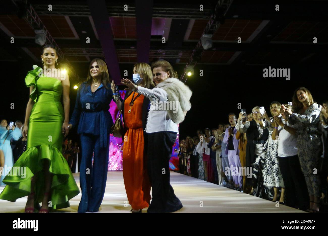 April 28, 2022, Valencia, Carabobo, Venezuela: Abril29, 2022. La diseÃ±adora  de moda, de fama internacional, Olga BolaÃ±os (d), saluda al publico en la  pasarela del WTC Hesperia fashion week, realizado el dia