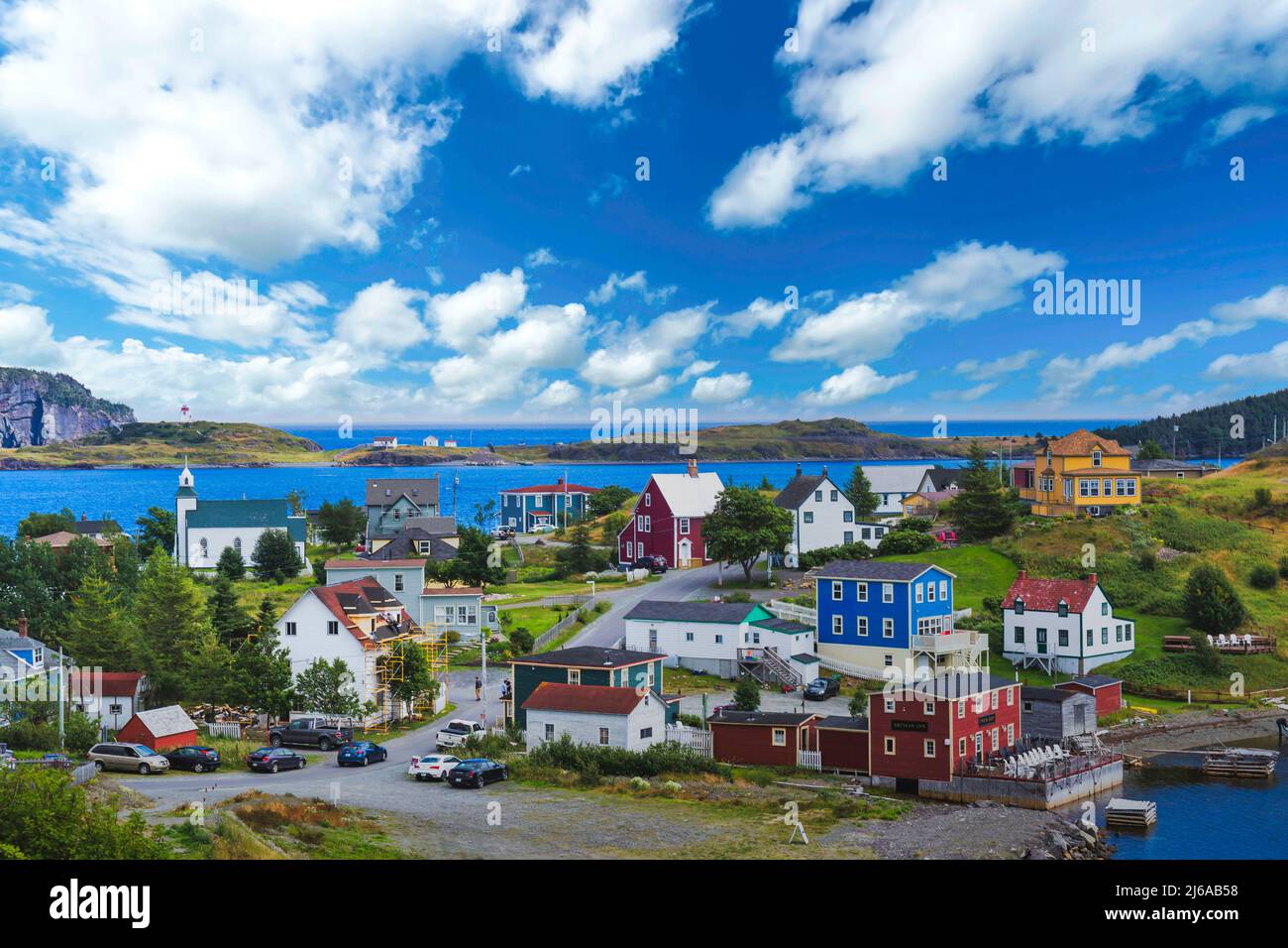 Family homes and a lighthouse in Trinity, Newfoundland Trinity, Newfoundland Ago 2021 Stock Photo