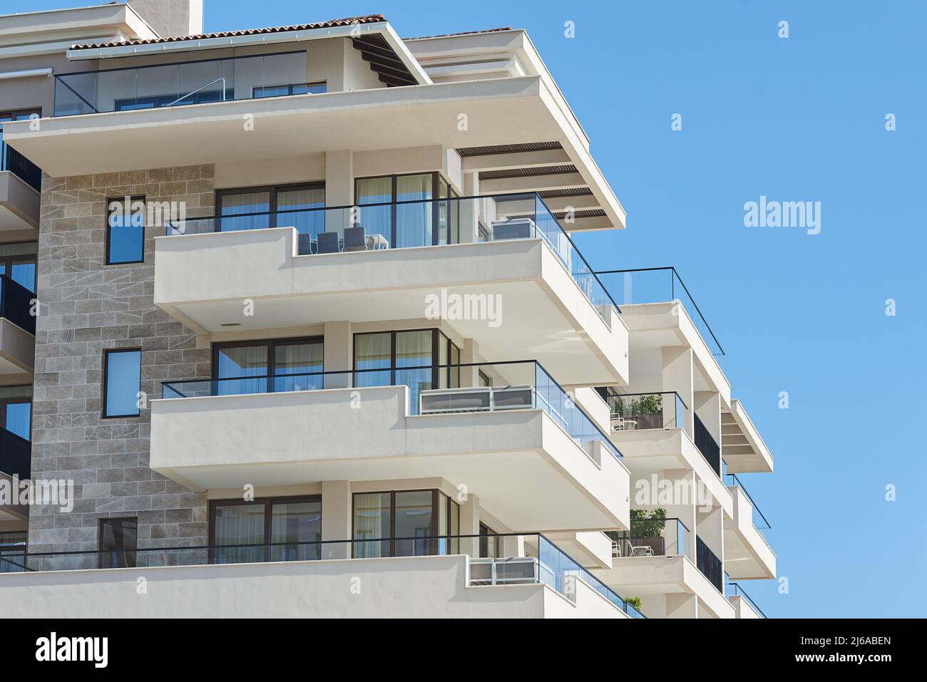 Balcony with glass railing in a modern apartment building Stock Photo