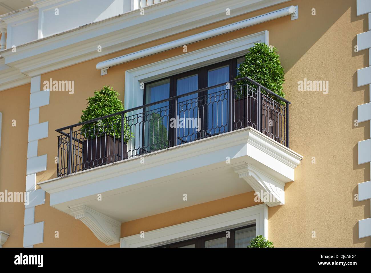 Balcony in the luxury house is decorated with potted plants Stock Photo