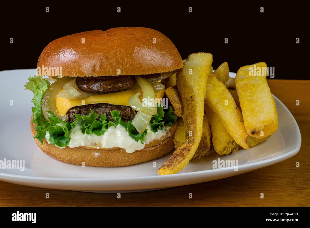 cheese burger top with sauteed onions and mushrooms Stock Photo Alamy