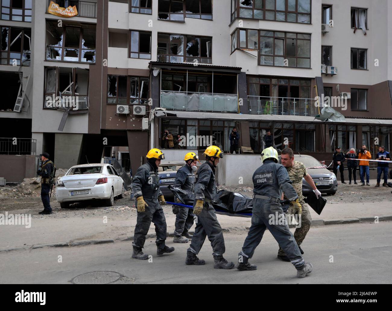 Rescuers carry the body of a dead woman who died during a Russian army missile strike. On April 28 2022, two Russian missiles hit Kyiv. One of them hit a 25-storey residential building. It was reported about 10 victims, of which four were hospitalized and on the next day, the mayor of Kyiv, Vitali Klitschko, said that as a result of a Russian missile hitting a high-rise building, one person died. At that moment, UN Secretary General António Guterres was in the capital of Ukraine, holding talks with President Volodymyr Zelensky. Stock Photo