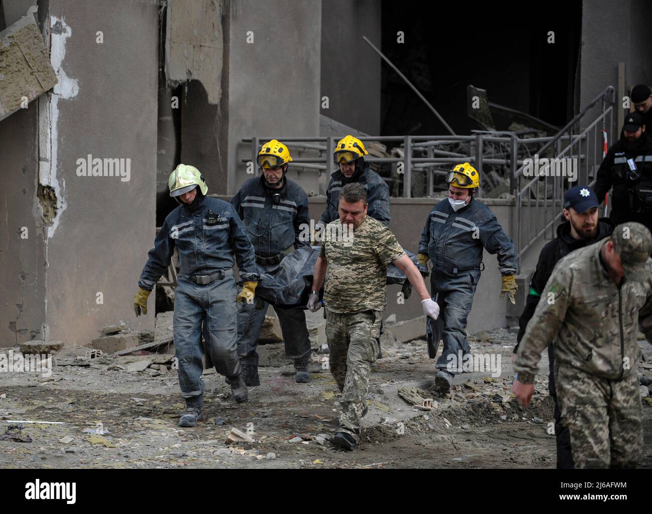 Kyiv, Ukraine. 29th Apr, 2022. April 29, 2022, Kyiv, Ukraine: Rescuers carry the body of a dead woman who died during a Russian army missile strike. On April 28 2022, two Russian missiles hit Kyiv. One of them hit a 25-storey residential building. It was reported about 10 victims, of which four were hospitalized and on the next day, the mayor of Kyiv, Vitali Klitschko, said that as a result of a Russian missile hitting a high-rise building, one person died. At that moment, UN Secretary General AntÃ³nio Guterres was in the capital of Ukraine, holding talks with President Volodymyr Zelensky. (Cr Stock Photo