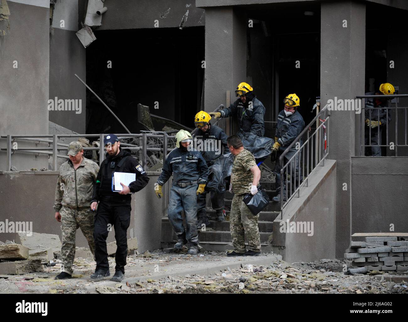 Kyiv, Ukraine. 29th Apr, 2022. April 29, 2022, Kyiv, Ukraine: Rescuers carry the body of a dead woman who died during a Russian army missile strike. On April 28 2022, two Russian missiles hit Kyiv. One of them hit a 25-storey residential building. It was reported about 10 victims, of which four were hospitalized and on the next day, the mayor of Kyiv, Vitali Klitschko, said that as a result of a Russian missile hitting a high-rise building, one person died. At that moment, UN Secretary General AntÃ³nio Guterres was in the capital of Ukraine, holding talks with President Volodymyr Zelensky. (Cr Stock Photo