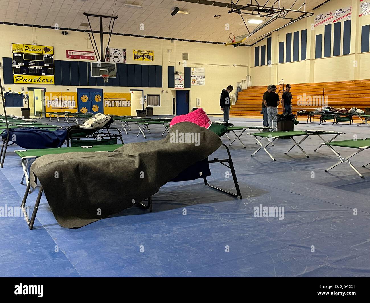 A view of an evacuation center at the high school gym set up for