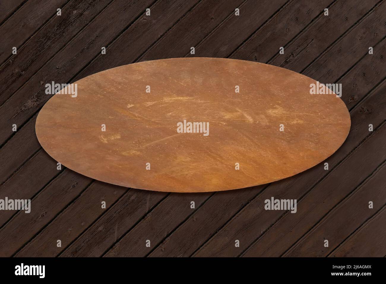 Old rusty metal plate for text templates on an old wooden wall Stock Photo