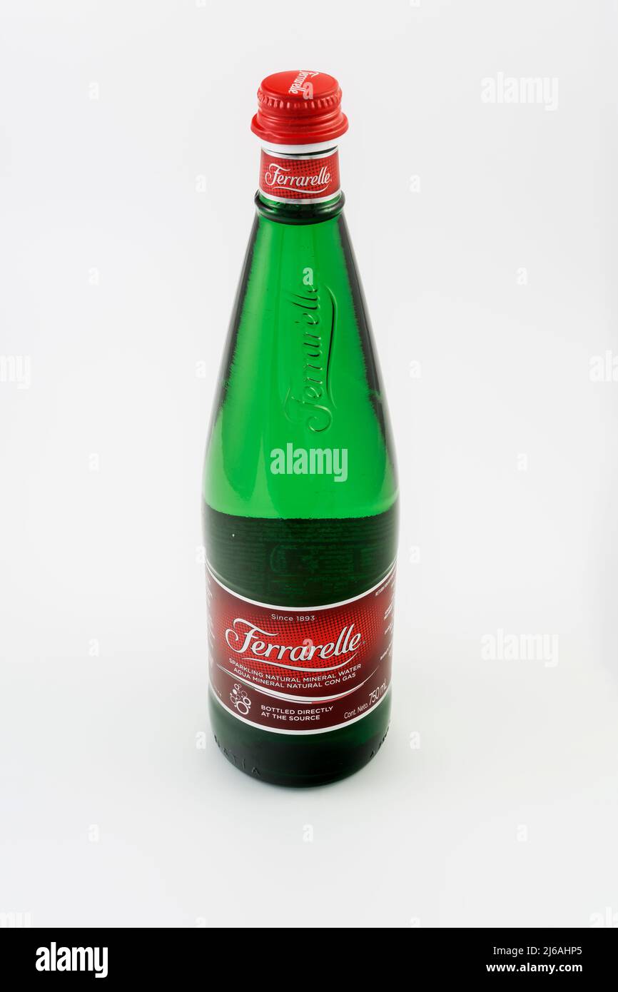 Ferrarelle sparkling natural mineral water with logo. Italian brand 750 ml glass bottle against white background. Stock Photo