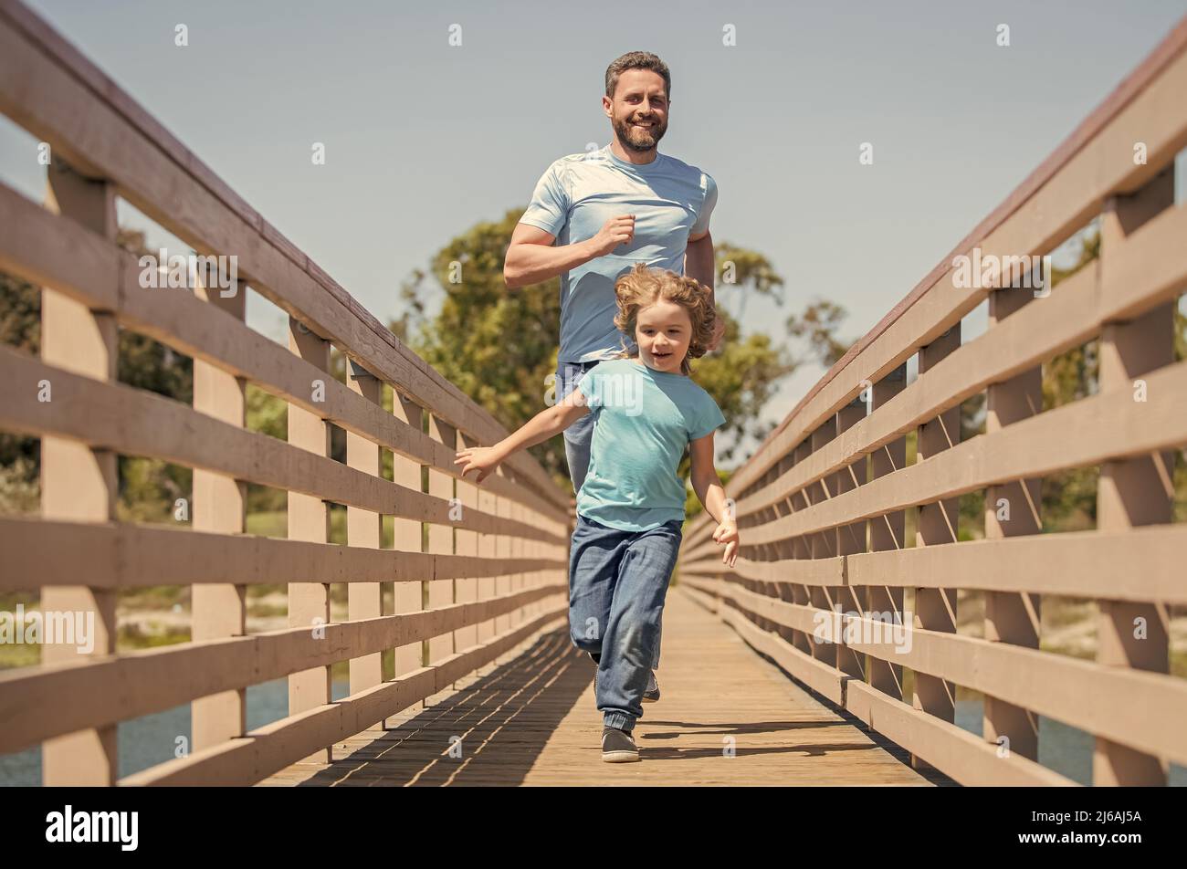 childhood and parenthood. parent relax with little child boy. dad with kid on summer day Stock Photo