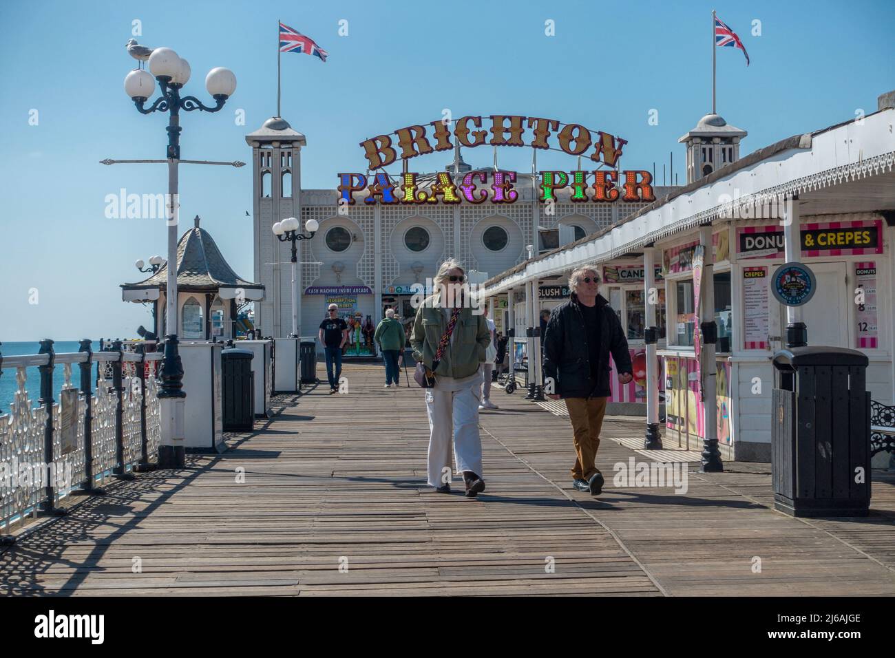 Brighton Palace Pier,People,Strolling,Enjoying Sunshine,Spring,Brighton,East,Sussex,England Stock Photo